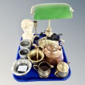 A tray containing a contemporary banker's lamp,