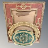 An ornate red and gilt frame together with a further gilt oval frame and a painted green and gilt