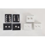 A collection of boxed diamonte earrings.
