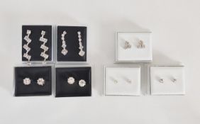 A collection of boxed diamonte earrings.