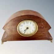 An Art Nouveau inlaid eight-day mantel clock.