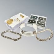 A cuff bangle stamped 925, two bracelets and four pairs of earrings.
