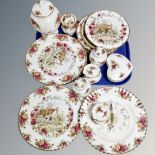 A collection of 17 pieces of Royal Albert Old Country Roses cabinet china, wall clocks, wall plates,