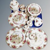 A collection of 17 pieces of Royal Albert Old Country Roses cabinet china, wall clocks, wall plates,