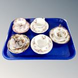 A tray containing a pair of antique Minton Spring Flowers bone china teacups and saucers together
