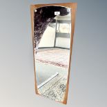 A continental teak framed mirror, 37cm by 91cm.