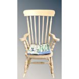 A contemporary pine farmhouse rail backed rocking chair