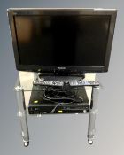 A Panasonic Viera 26" LCD TV together with a Panasonic DMR-EZ47V DVD/VCR recorder, both with leads,