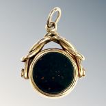 An 18ct yellow gold bloodstone swivel fob, width 21.1 mm, gross 8.7g.