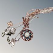 Three silver necklaces including a silver gilt chain and flower pendant, a Danish pilgrim chain etc.