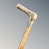 An antique antler-handled sword stick.
