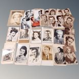 A tray containing a large quantity of mid-20th century American movie star photographs,