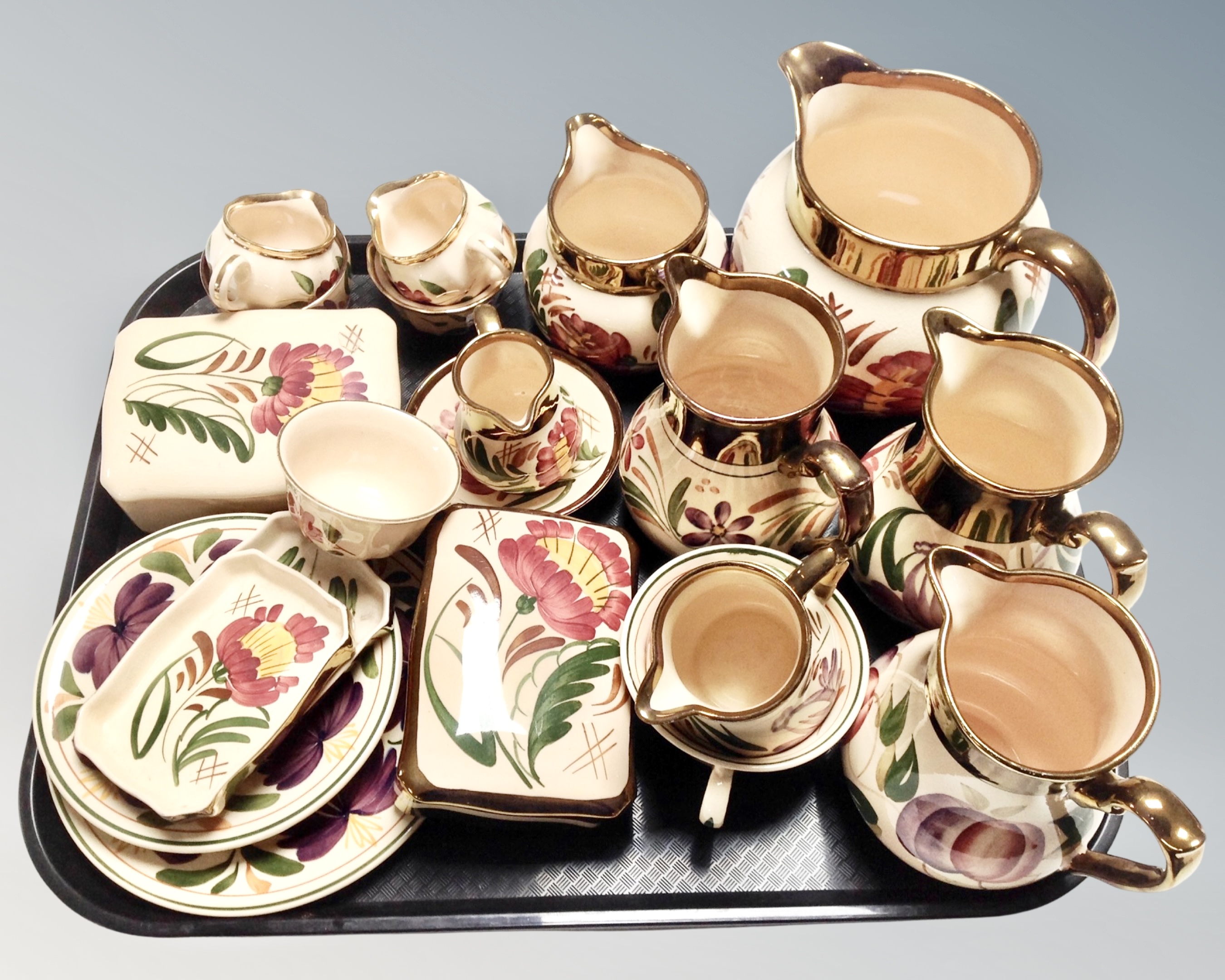 A collection of 20 pieces of Wade hand painted gilded jugs, tea ware, lidded trinket pots etc.