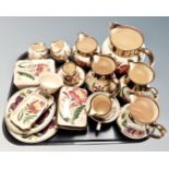 A collection of 20 pieces of Wade hand painted gilded jugs, tea ware, lidded trinket pots etc.