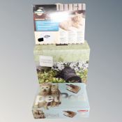 A Staywell pet pod together with a Petsafe universal pet bed warmer and a natural wicker hedgehog