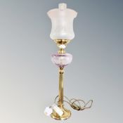 A table lamp in the form of a Victorian oil lamp.