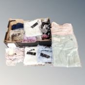 A box containing approximately 20 pieces of new and tagged lady's clothing including Indigo & Co.