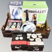 A box containing kitchenalia including a NutriBullet 12 piece set, a Tower Cera Glide 2-in-1 iron,