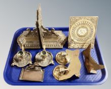 A tray containing assorted brass ware including a candlestick, a pair of ornate griffin bookends,