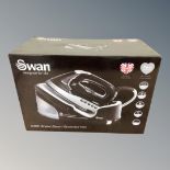 A Swan 2400W steam generating iron, boxed.