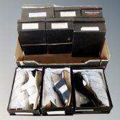 A box containing nine pairs of Cushion Walk lady's shoes, boxed.