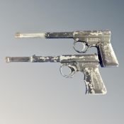 Two Gat air pistols.