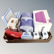 A box containing kitchenalia including Piranha peelers, tupperware, dishes, a Nova slice and dice,