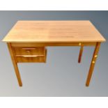 A 20th century Scandinavian teak writing desk fitted with two drawers,