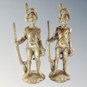 A pair of brass figures of soldiers.