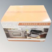 A Wolfgang Puck pressure oven, boxed.