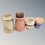 Five assorted plant pots together with two chimney pots