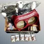 A box containing pet accessories including pet bed, drinking bowl stand, pet blinkers, balls etc,