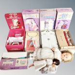 A box containing two dolls, a Cindy's dressing table with stool,