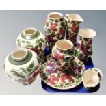 Eight pieces of Wade floral patterned pottery.