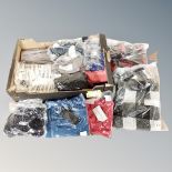 A box containing approximately 20 pieces of new and tagged lady's clothing.
