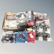 A box containing approximately 20 pieces of new and tagged lady's clothing.