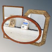 A 19th century oval inlaid mahogany framed bevelled mirror,