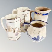 Four antique pottery jugs.