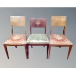 Three inlaid mahogany continental dining room chairs.