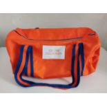 A Calvin Klein CK One Orange duffle bag (New).