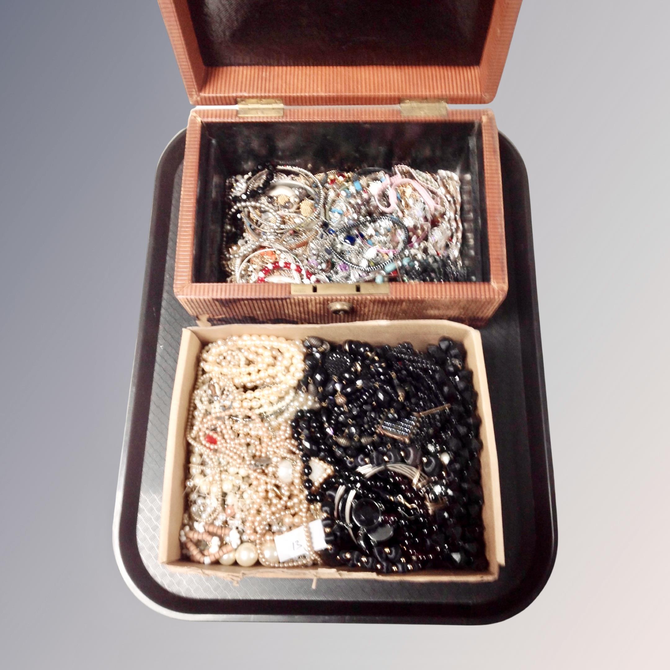 A Victorian leather jewellery box and contents together with a box of pearls and mourning jewellery.