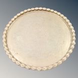 An Eastern circular brass tray.