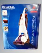 A Bissell Dirtlifter carpet cleaner together with a Bissell stain eraser model 20061 and three