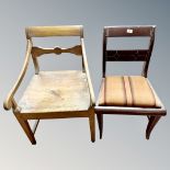 An antique pine dining room chair together with a further painted chair.