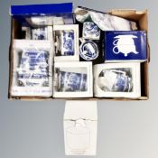 A box containing a quantity of boxed and unboxed Ringtons willow pattern ceramics and tea towel.