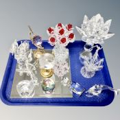 A tray containing assorted crystal ornaments and animal figures together with a mirrored stand.