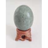 Green Lushan Jade sphere with stand - Weight: 90g. Length: 36mm. Width: 36mm. Height: 48mm.