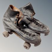 A pair of vintage roller blades.