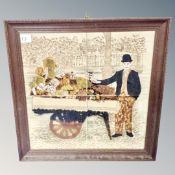 A set of four tiles depicting a man with cart, in oak frame.