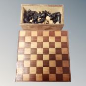 A boxwood chess set together with a wooden chessboard (diameter 20cm)